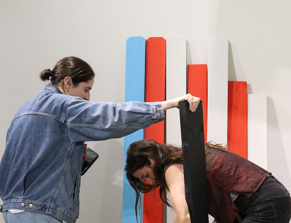 People interacting with the wooden pieces at ambiplayground installation